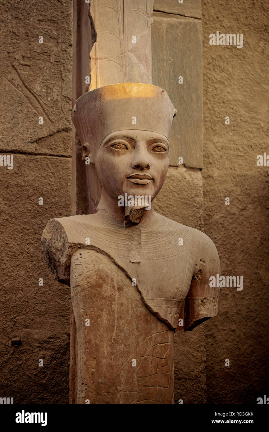 Pharaoh's statue in the ancient ruins of the Temple of Karnak in Luxor ...