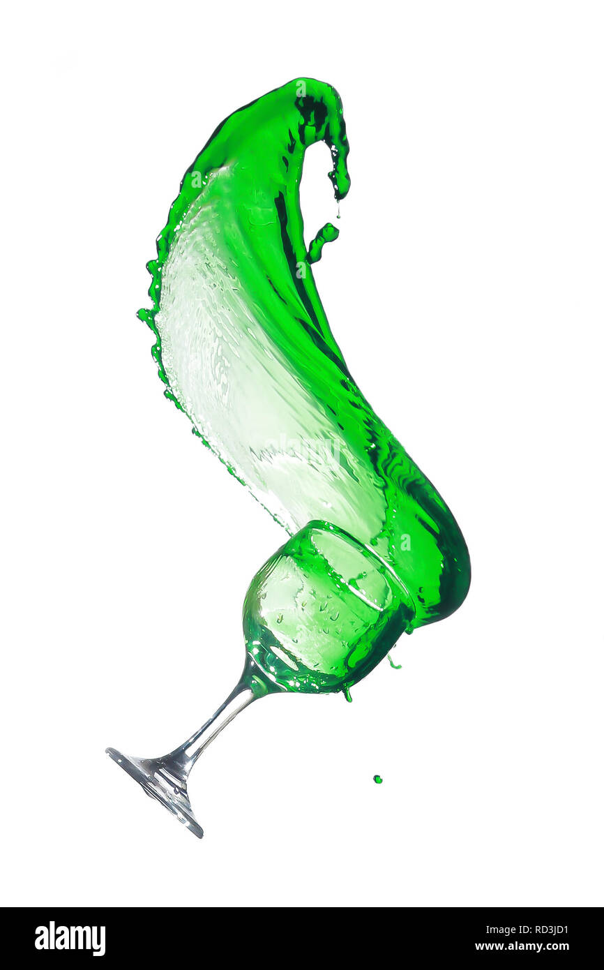 Green liquid splashing out of a glass Stock Photo