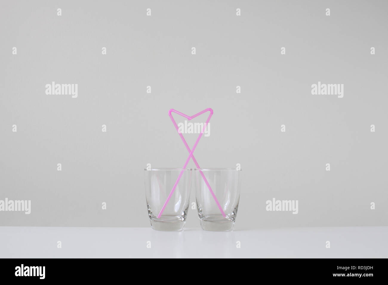 Two straws in an empty glass hires stock photography and images Alamy
