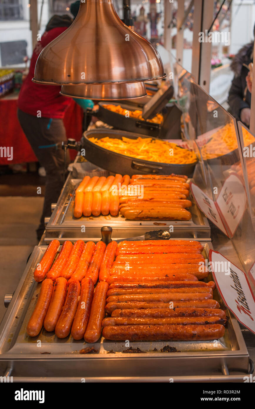 German sausages on sale at street stall at Christmas market in Vienna