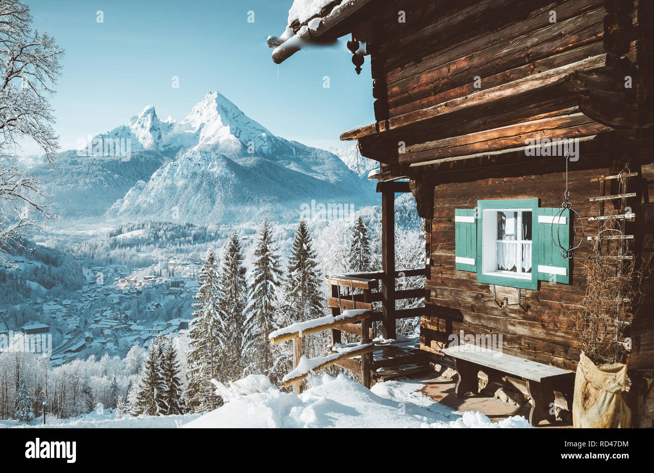 Beautiful view of traditional wooden mountain cabin in scenic winter wonderland mountain scenery in the Alps Stock Photo