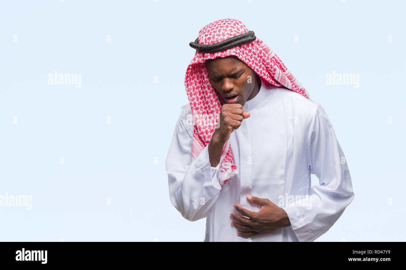 Young arabic african man wearing traditional keffiyeh over isolated