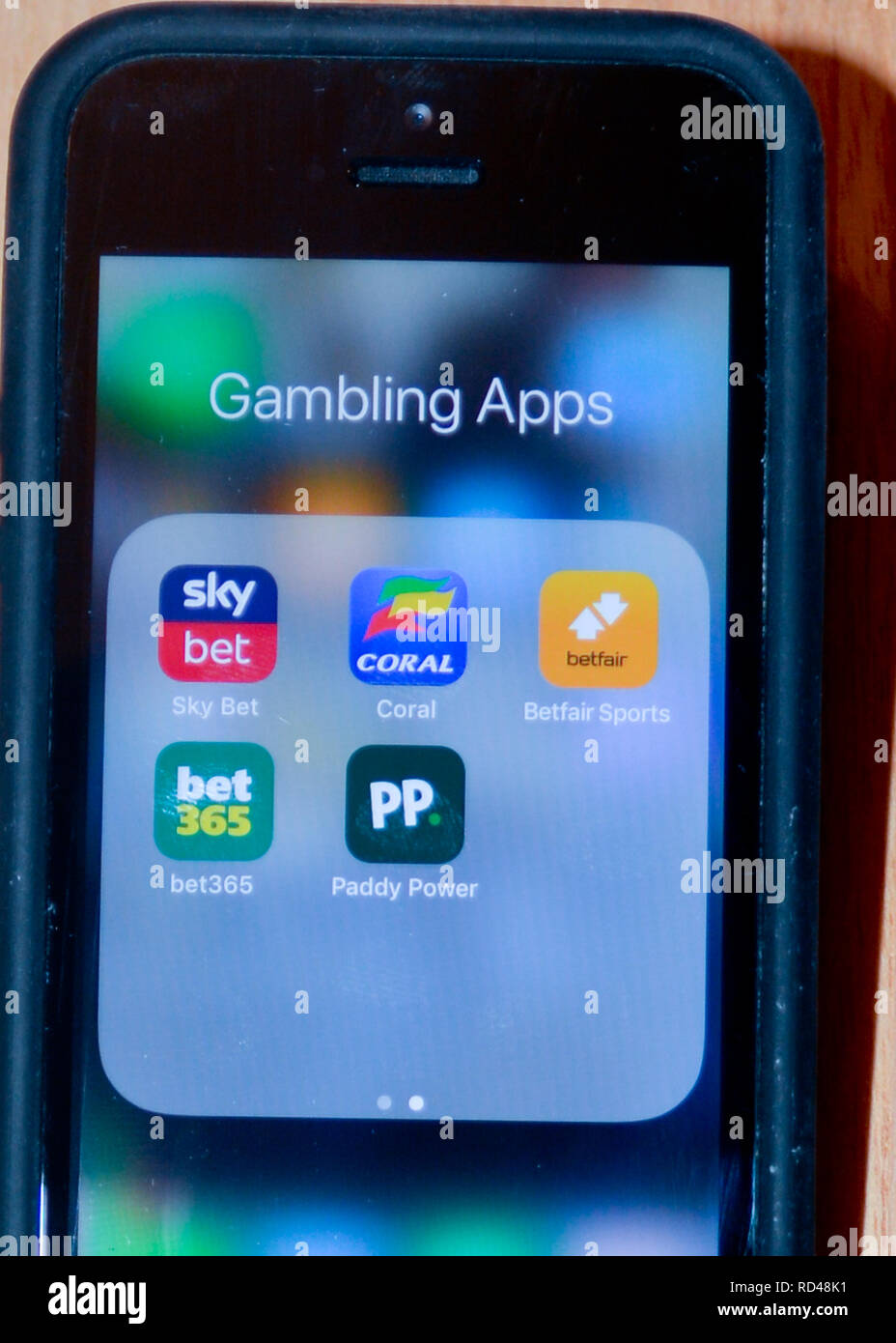 A number of gambling apps on a smart phone - these apps make it easy to gamble from anywhere at any time Stock Photo