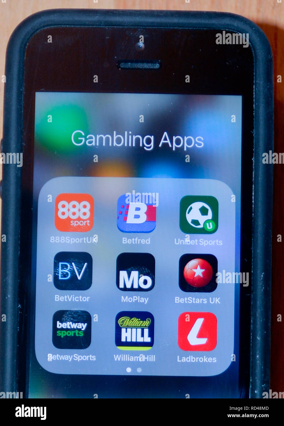A number of gambling apps on a smart phone - these apps make it easy to gamble from anywhere at any time Stock Photo