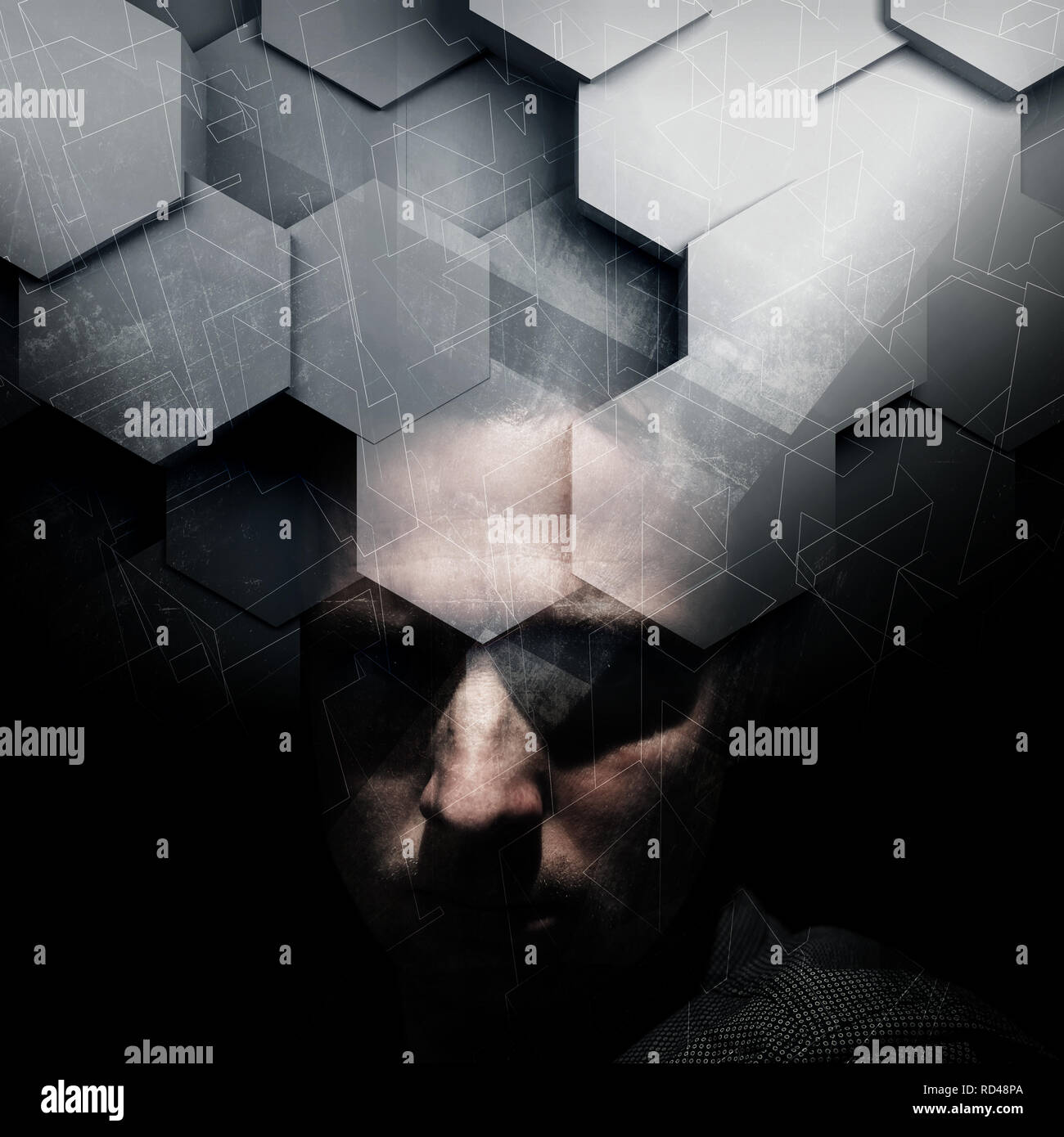 Dark portrait of young European man over black background with high-tech hexagonal pattern Stock Photo