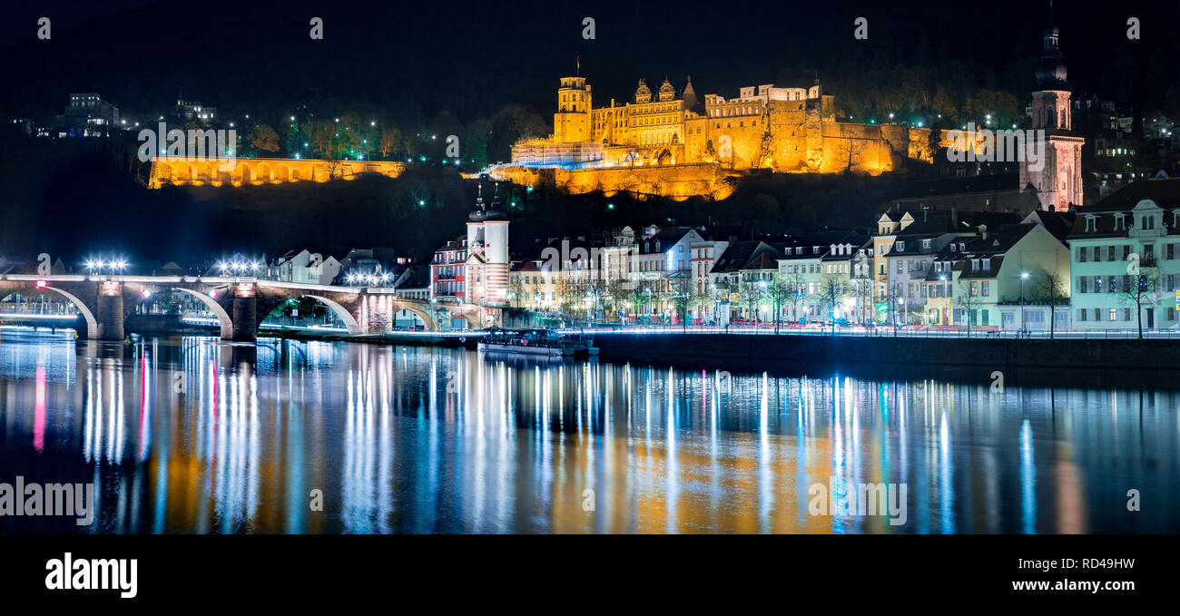 Panoramic view of the old town of Heidelberg reflecting in beautiful Neckar river at night, Baden-Wuerttemberg, Germany Stock Photo