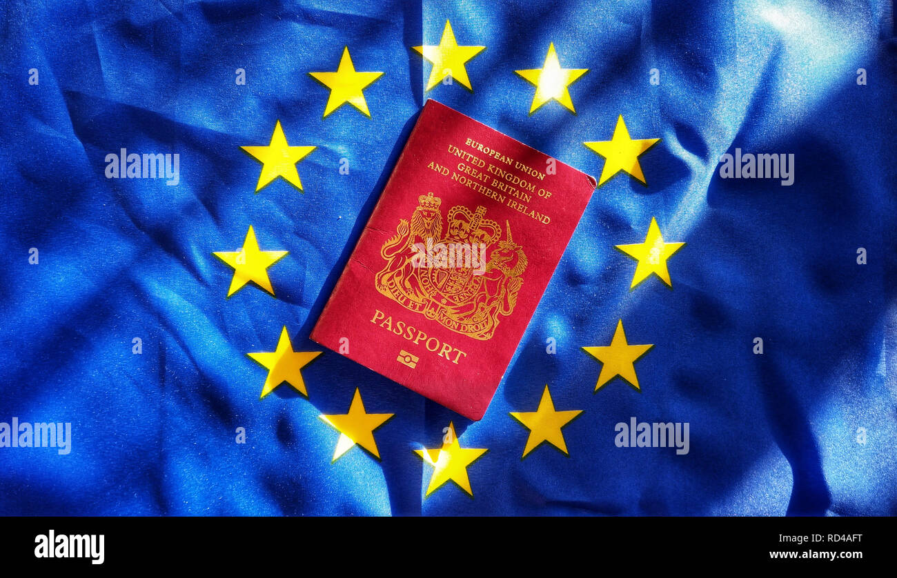 January 15, 2019 - Munich, Bavaria, Germany - A British passport laid upon the European Union flag symbolizing what is at stake for  Britons living in the EU in the event of a hard Brexit. Britons living overseas more than 15 years did not receive the right to vote, despite early promises, and stand to lose the most. (Credit Image: © Sachelle Babbar/ZUMA Wire) Stock Photo