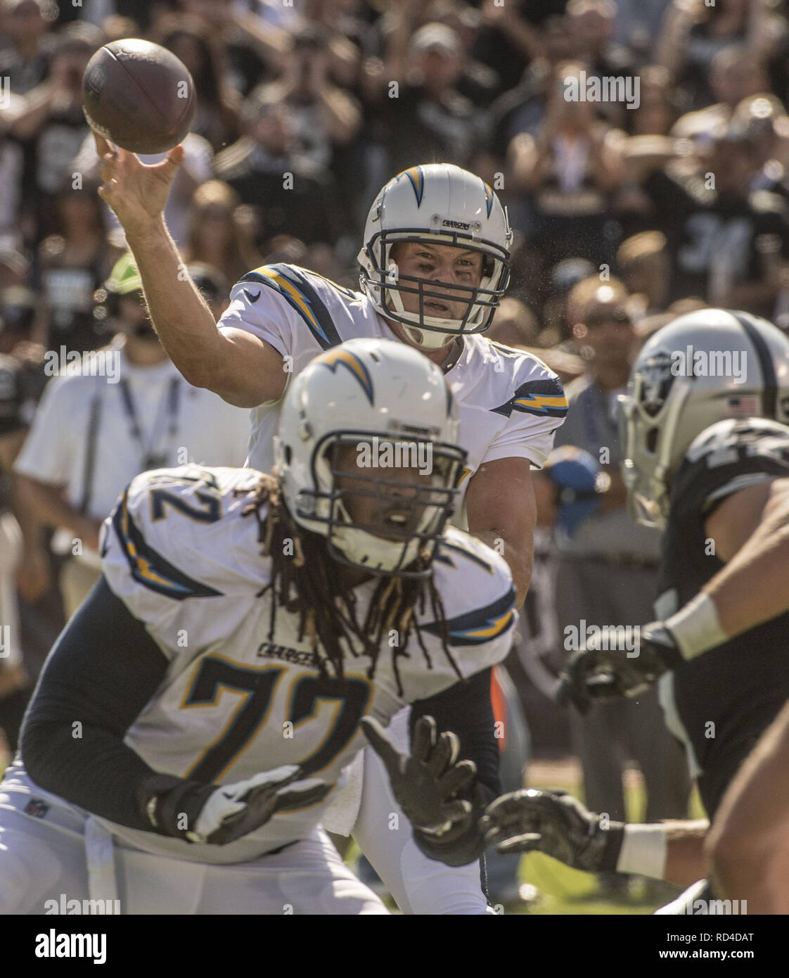 October 15, 2017 - Oakland, California, U.S - Los Angeles Chargers quarterback Philip Rivers (17) fires pass downfield on Sunday, October 15, 2017, at Oakland-Alameda County Coliseum in Oakland, California.  The Chargers defeated the Raiders 17-16. (Credit Image: © Al Golub/ZUMA Wire) Stock Photo