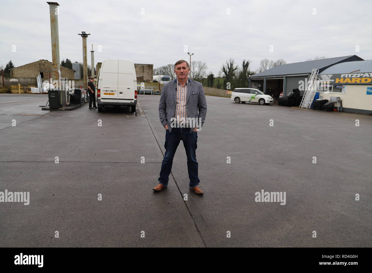 Dublin. 17th Jan, 2019. Photo taken on Jan. 10, 2019 shows local businessman Eamon Fitzpatrick standing between his fuel station (L) and hardware store (R), which are separated by the Ireland-UK border, in Drummully Polyp of Clones, Ireland. TO GO WITH feature:Border residents waiting in confusion for Brexit results Credit: Xinhua/Alamy Live News Stock Photo