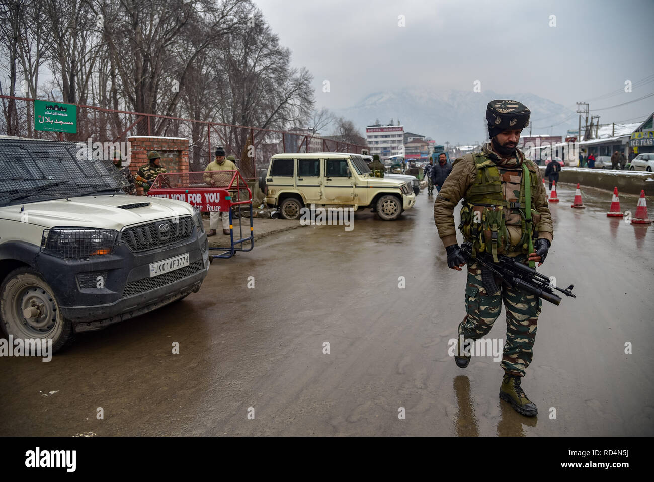 An Indian army-man seen Patrolling near the site of explosion in Srinagar. According to Police, at least five members of government forces were injured on Thursday in a grenade explosion blamed on rebels fighting against Indian rule in Indian-controlled Kashmir's main city. Stock Photo
