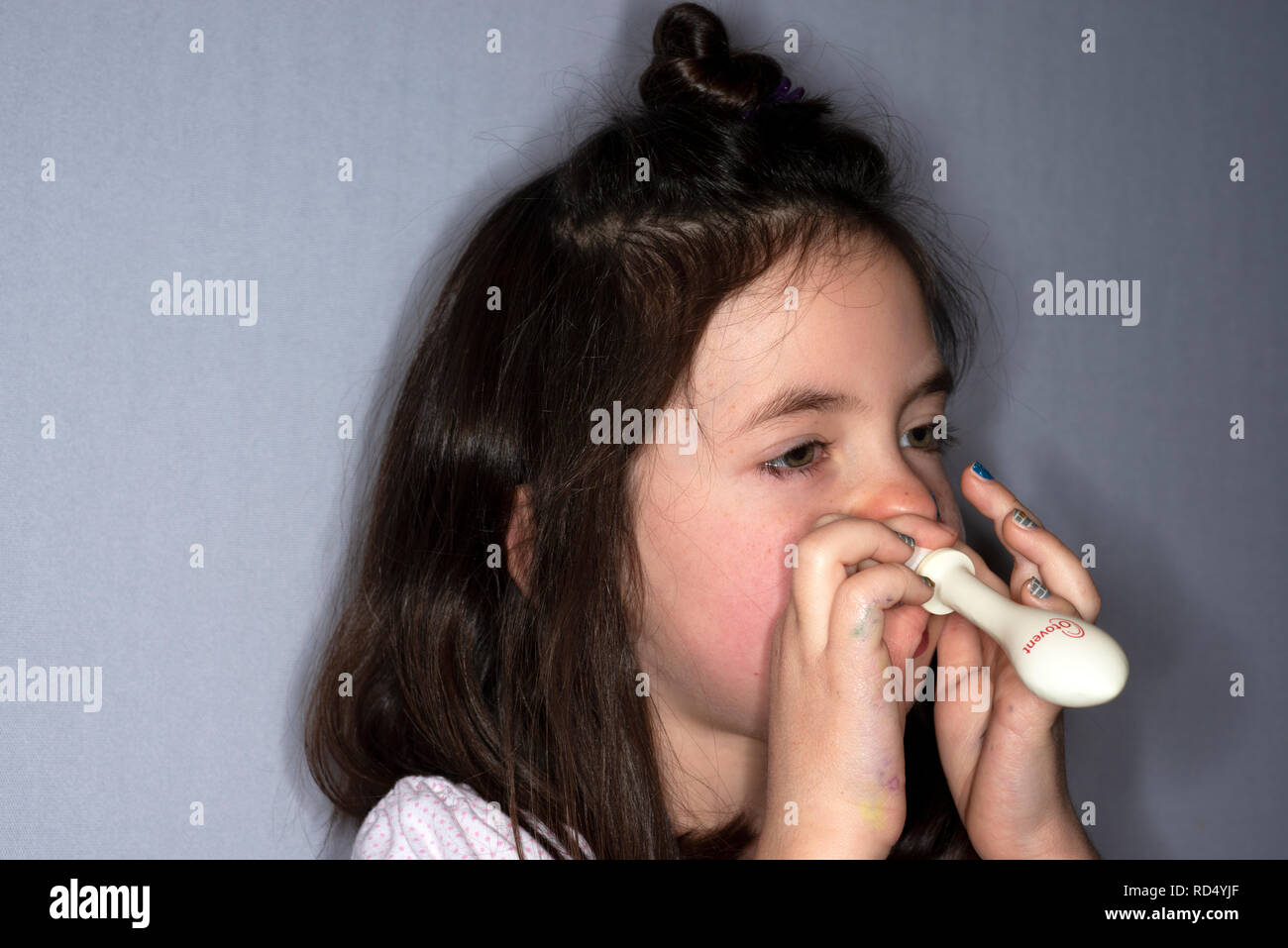 Otovent nasal ballon for treatment of clogged ears, fluid in the ears, and ear infections. Stock Photo