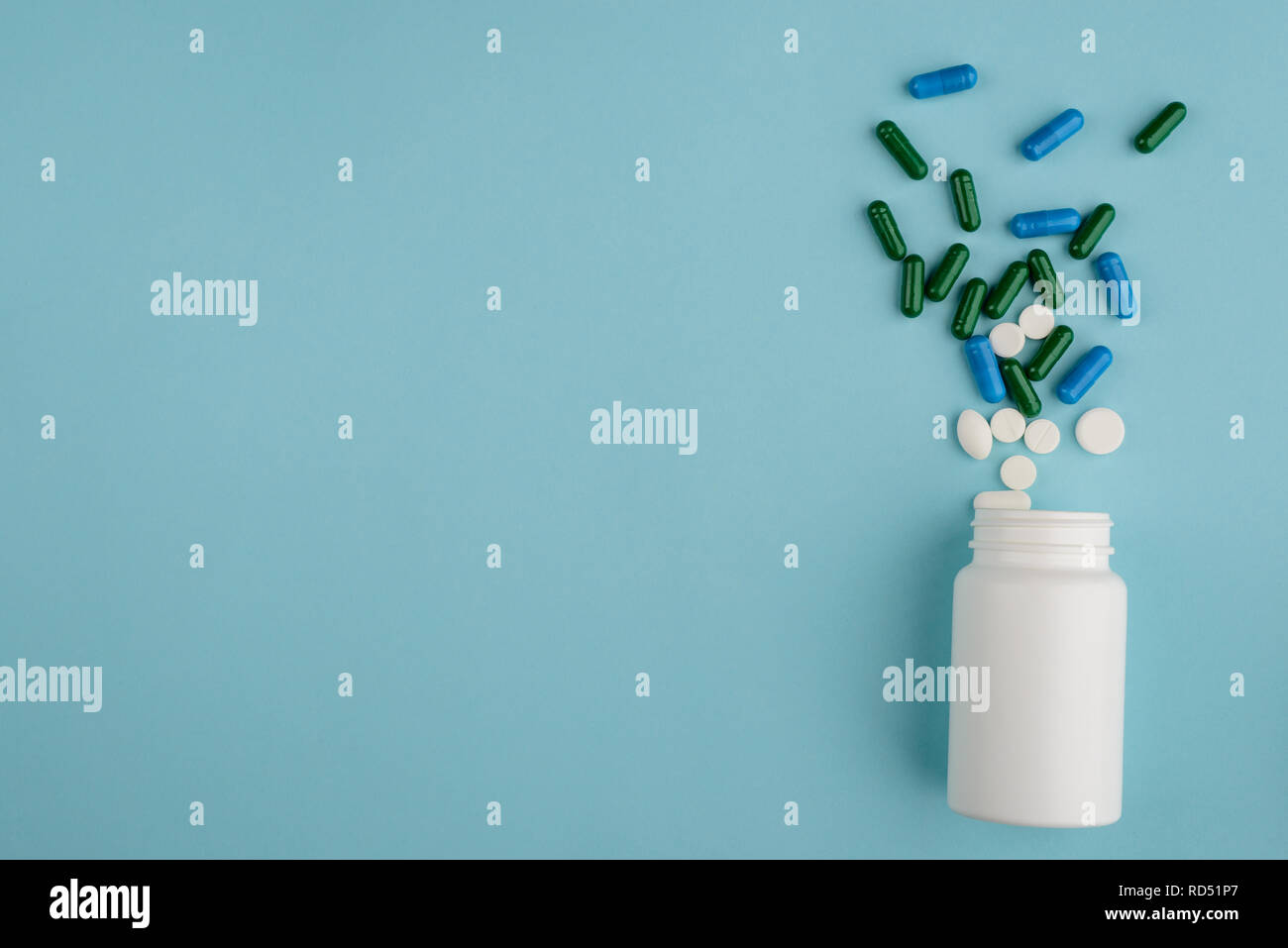 Plastic bottle and spilled pills Stock Photo