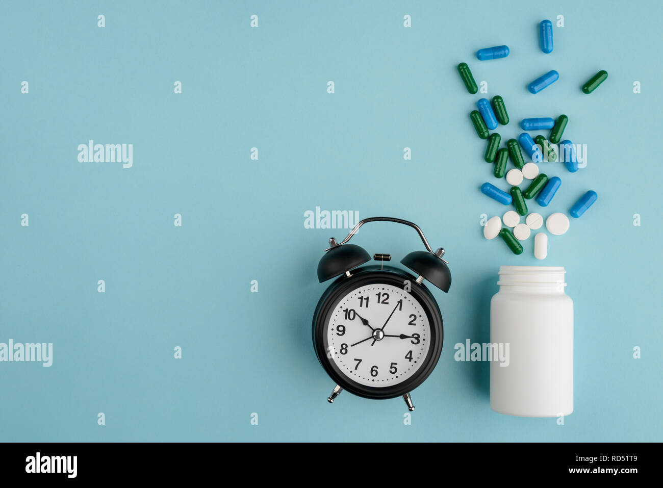 Alarm clock and sleeping pills Stock Photo Alamy