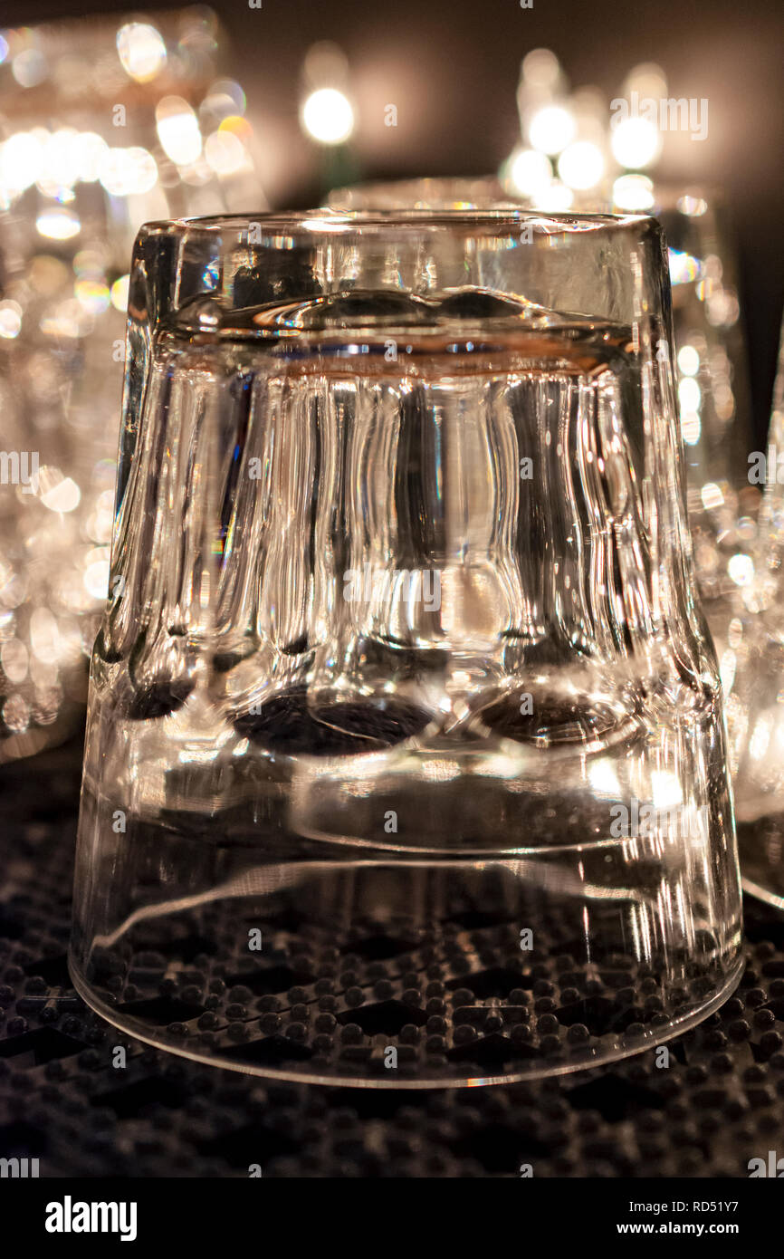 Vertical selective focus shot of glass water pitchers and empty upside-down  glasses on a tray Stock Photo by wirestock