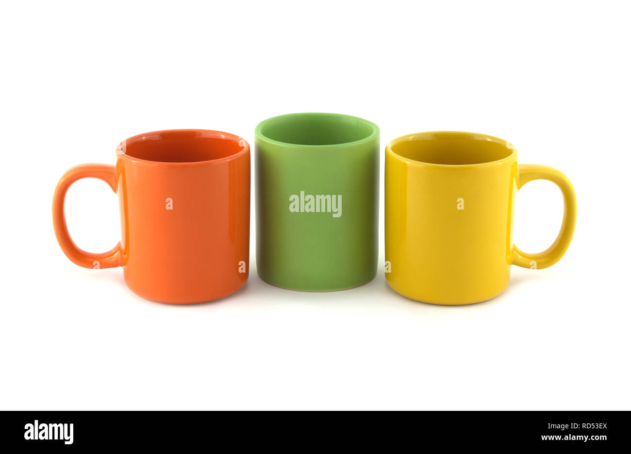 Download Three Big Empty Orange Green And Yellow Tea Or Coffee Cups Isolated On White Close Up Dishes Studio Shot Stock Photo Alamy PSD Mockup Templates