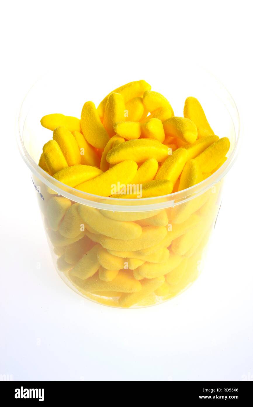 Yellow candy bananas in a clear cup Stock Photo
