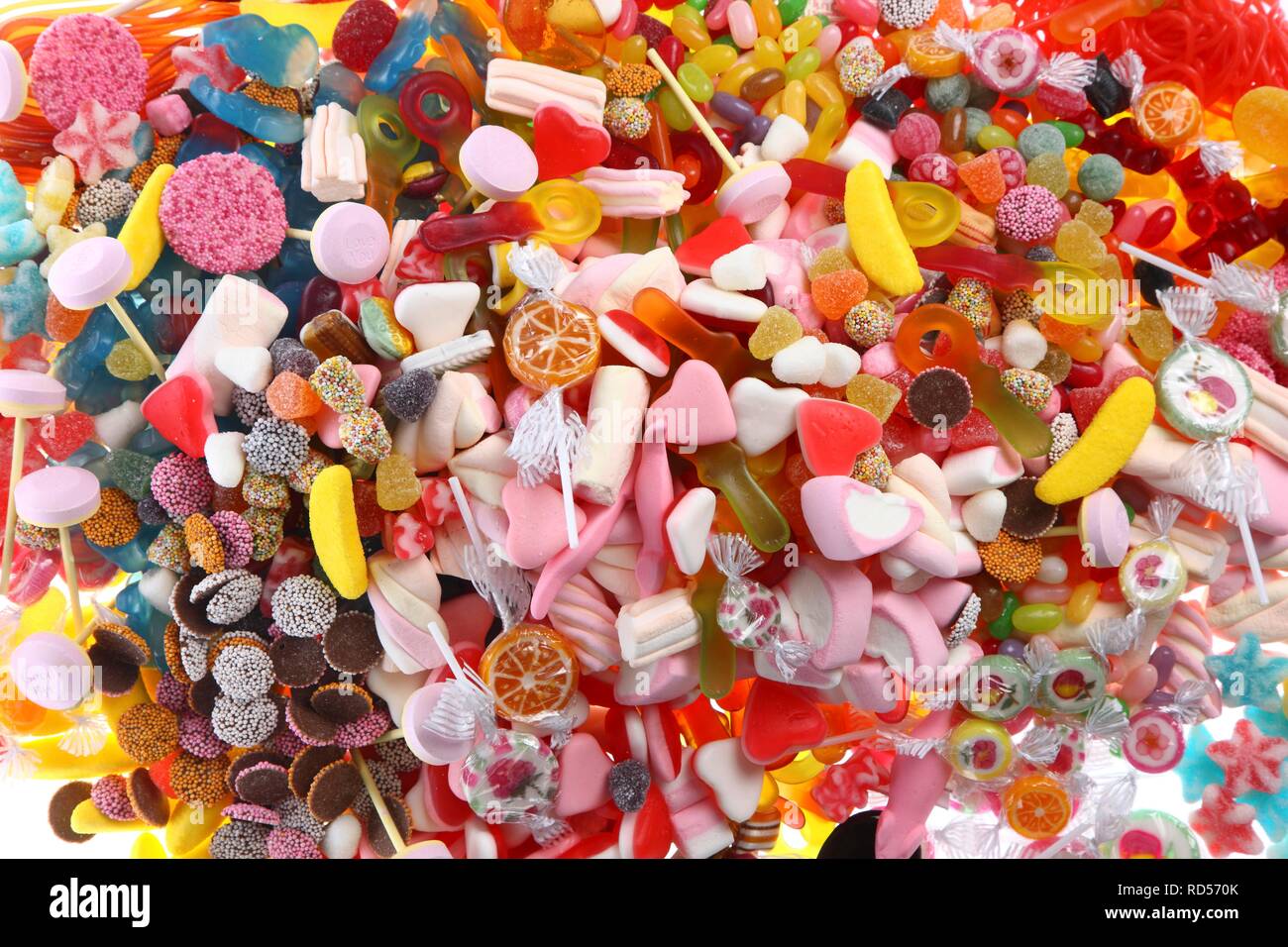 Clear plastic bags with a variety of fruit gums, marshmallows, candies