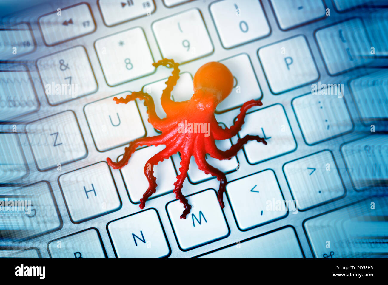 Octopus figurine on computer keyboard, data leech Stock Photo - Alamy