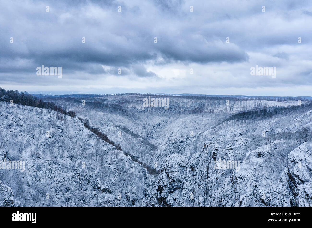 Vast Harz mountain range of central Germany under a moody clouds sky in winter Stock Photo