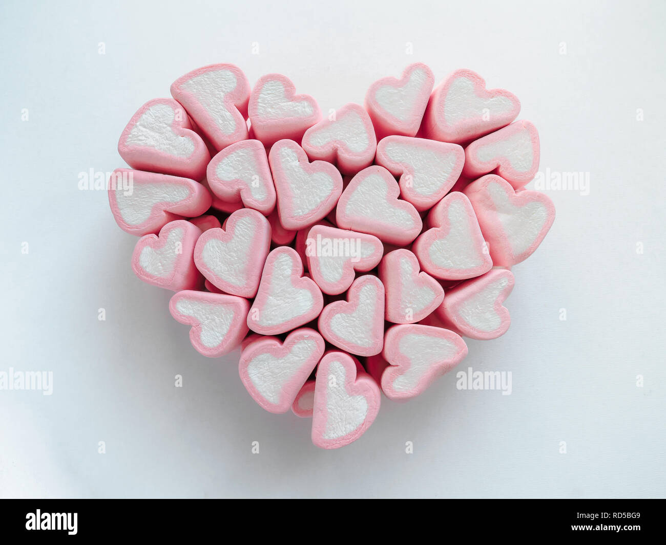 Pink heart shaped marshmallows on white background Stock Photo - Alamy