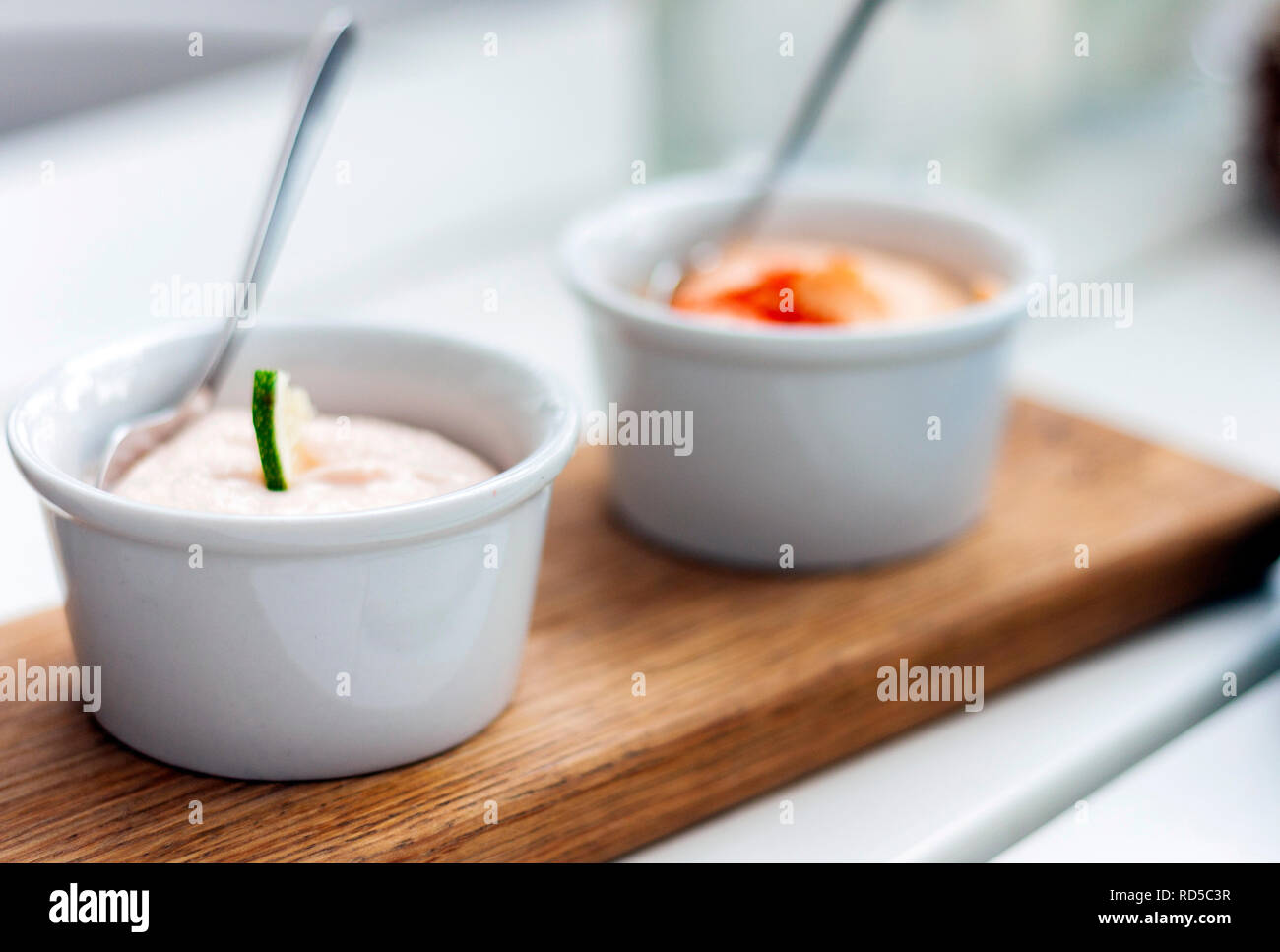 Sauces in small bowls for traditional meze dinner. Stock Photo