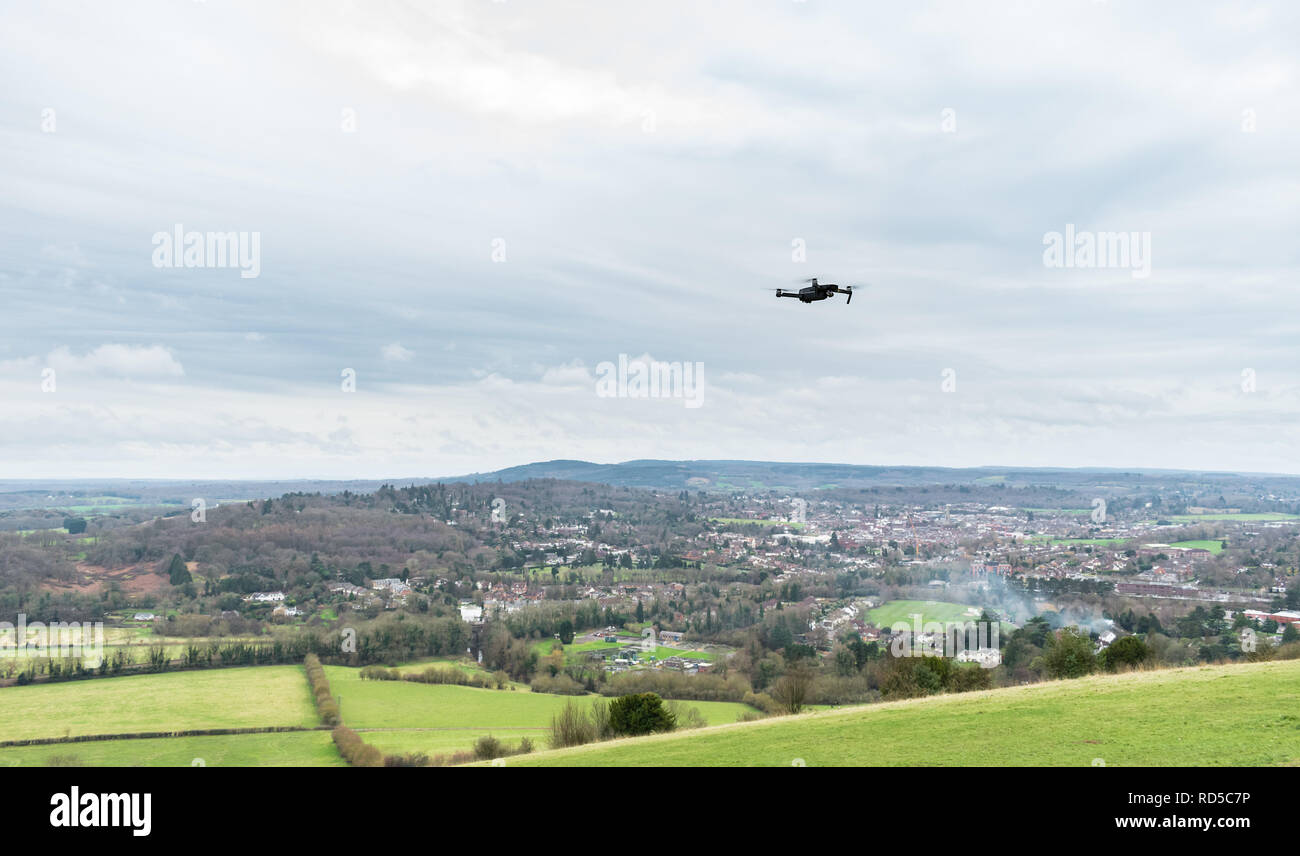 Drone flying over the view from Box Hill in the Surrey Hills, England, UK on a cloudy winter day. The background stretches to Leith Hill from Dorking Stock Photo