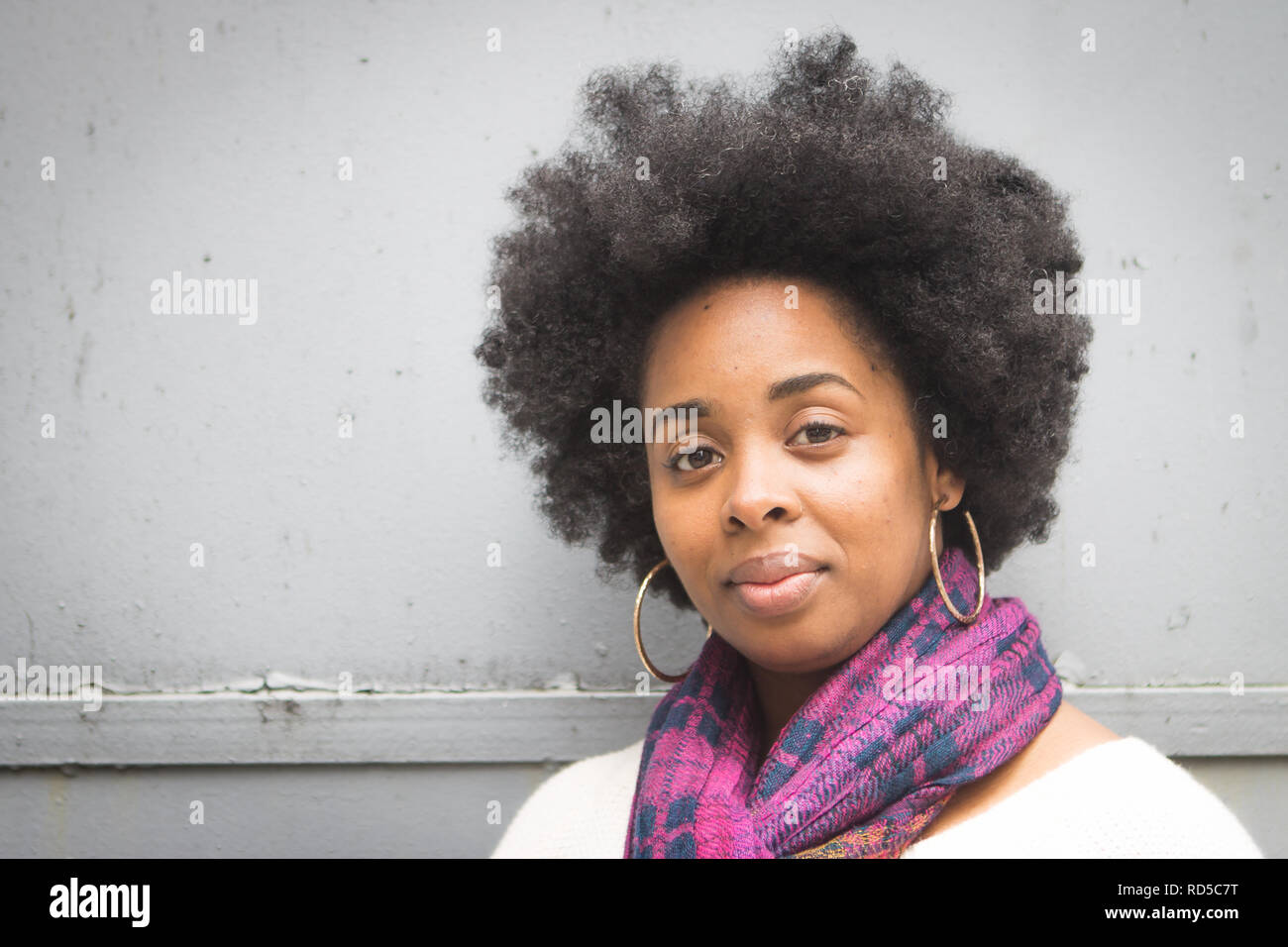 Close-up of African American woman with afro outside Stock Photo