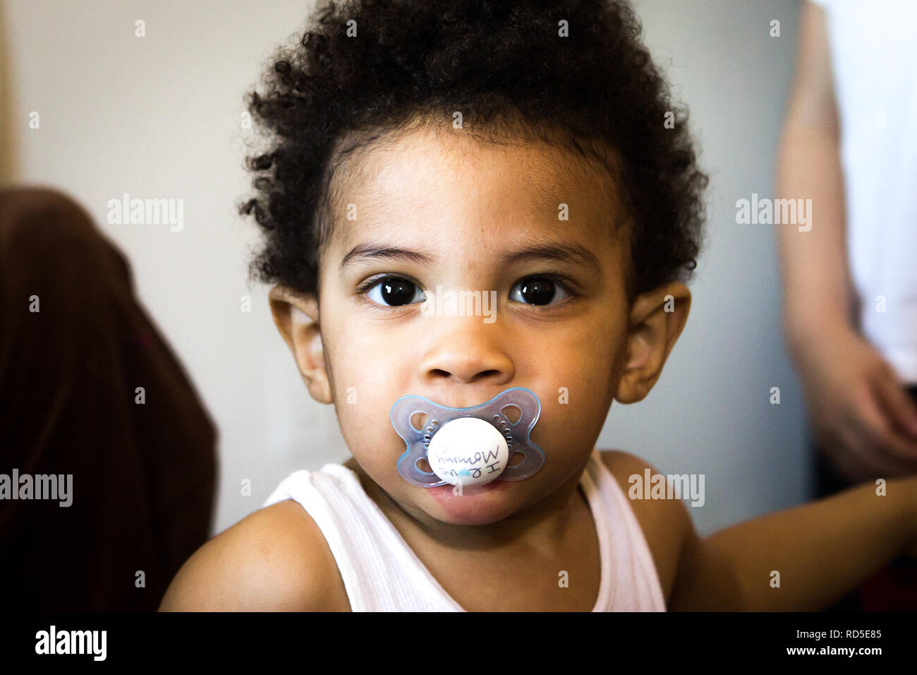 Close up ethnic boy with pacifier hi-res stock photography and images -  Alamy
