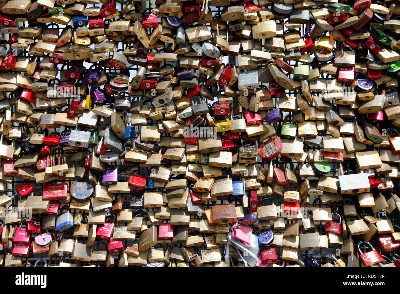 Love locks on the Hohenzollern Bridge, locked to the fence mesh by lovers since the late summer of 2008, as a token of love Stock Photo
