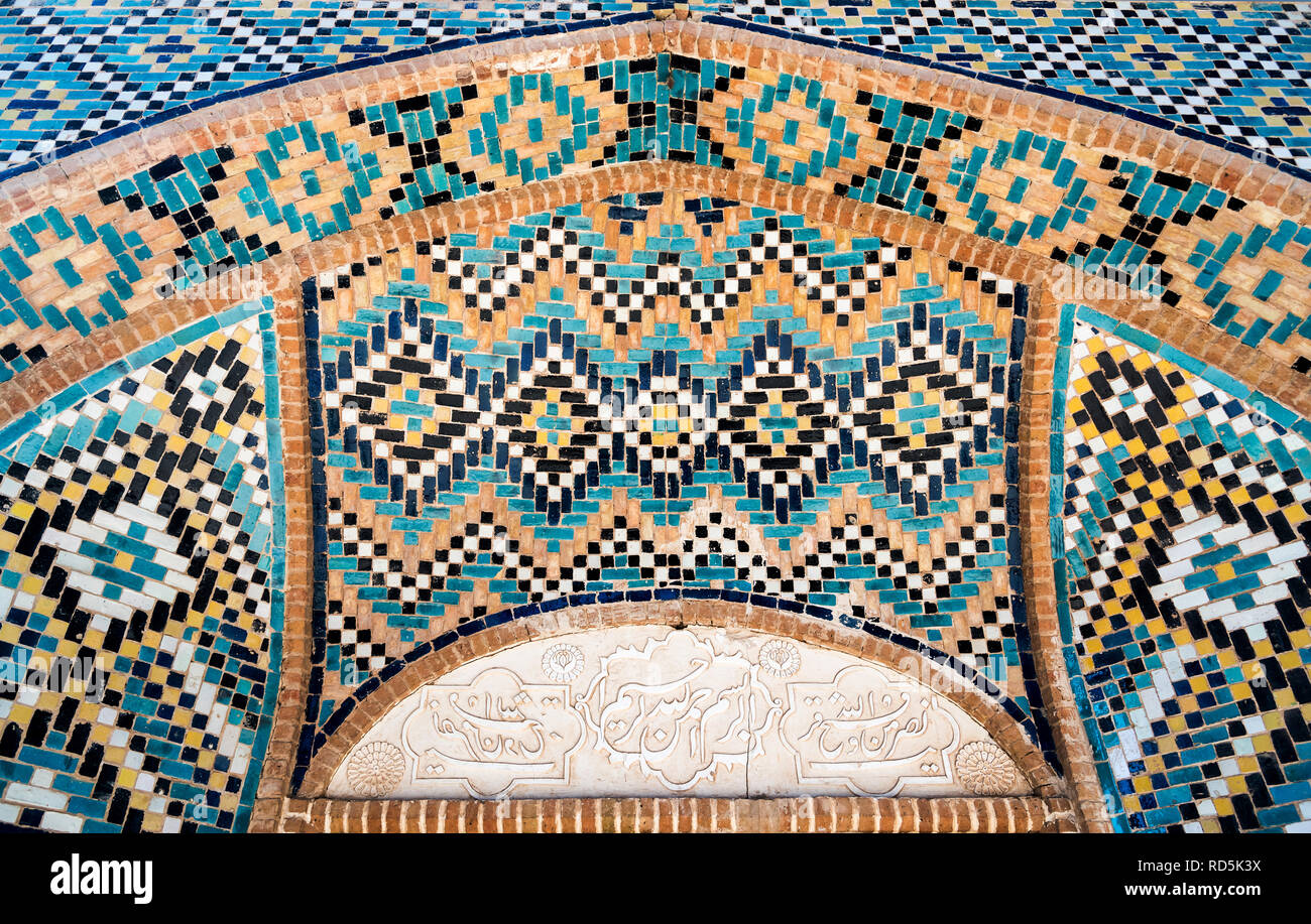 Beautiful decoration in turquoise blue tiled mosaic with geometric motifs, Shah Nematollah Vali Shrine, Iran Stock Photo
