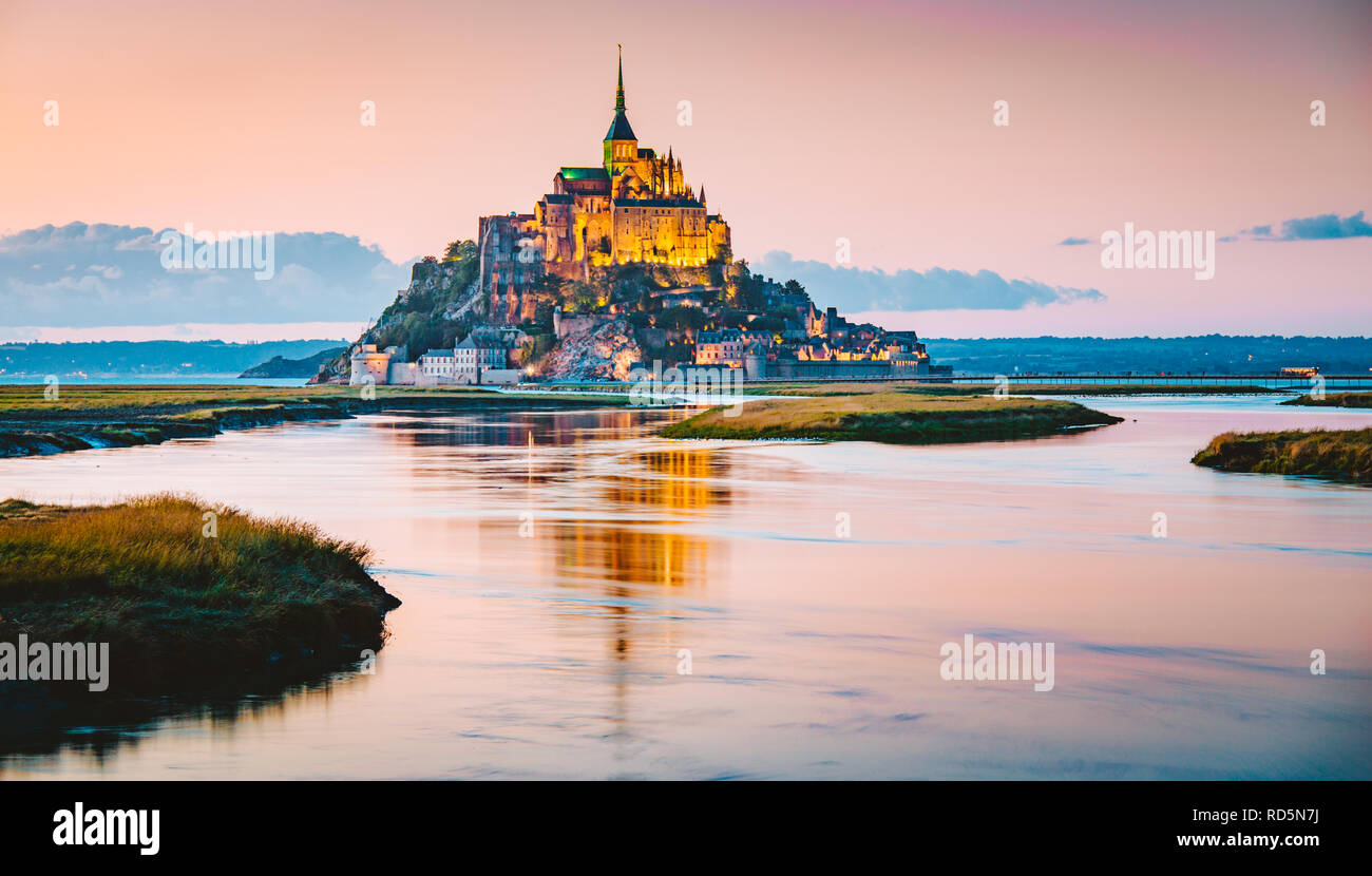 Classic view of famous Le Mont Saint-Michel tidal island in beautiful evening twilight at dusk, Normandy, northern France Stock Photo