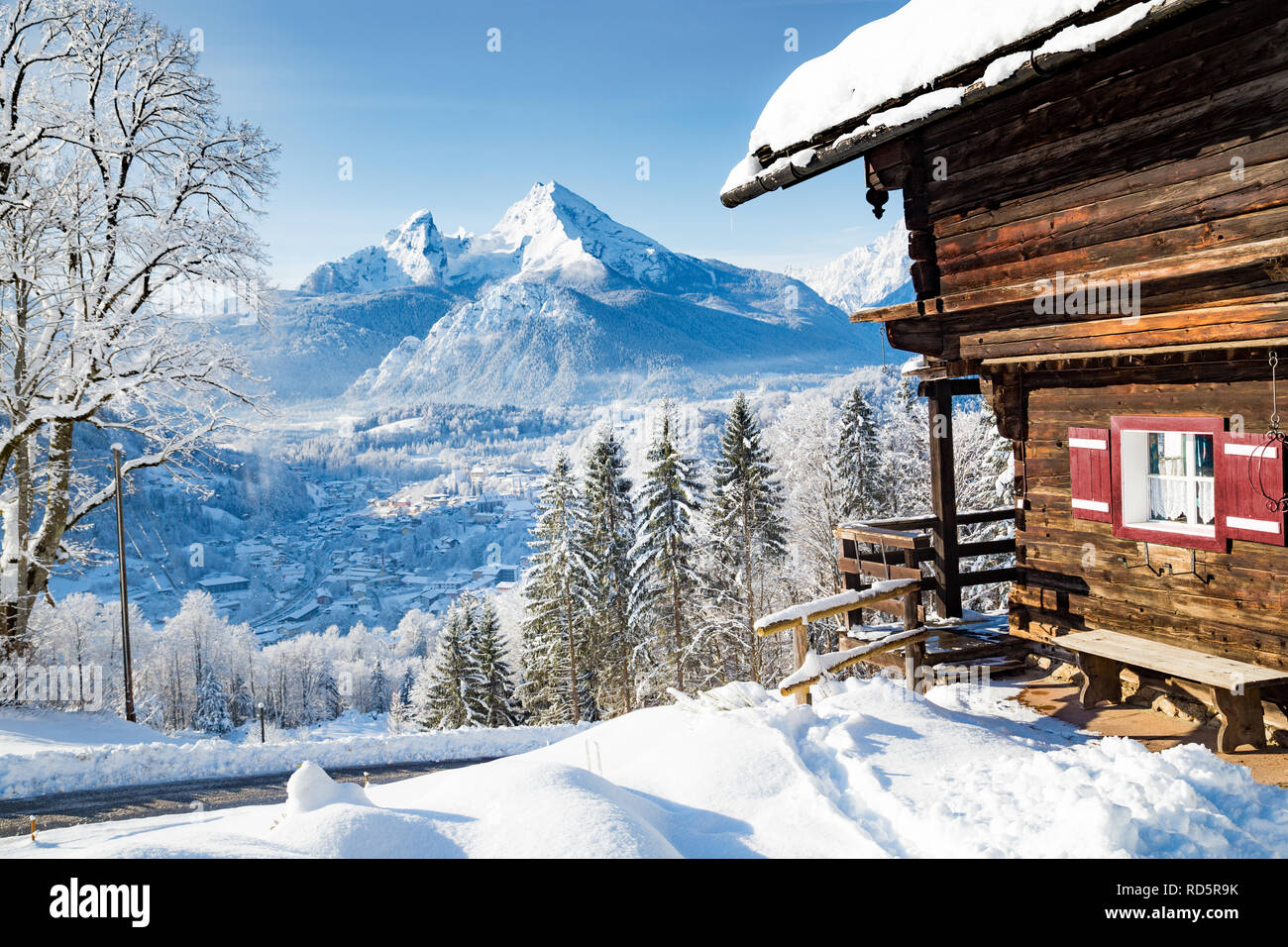 Beautiful view of traditional wooden mountain cabin in scenic winter wonderland mountain scenery in the Alps Stock Photo