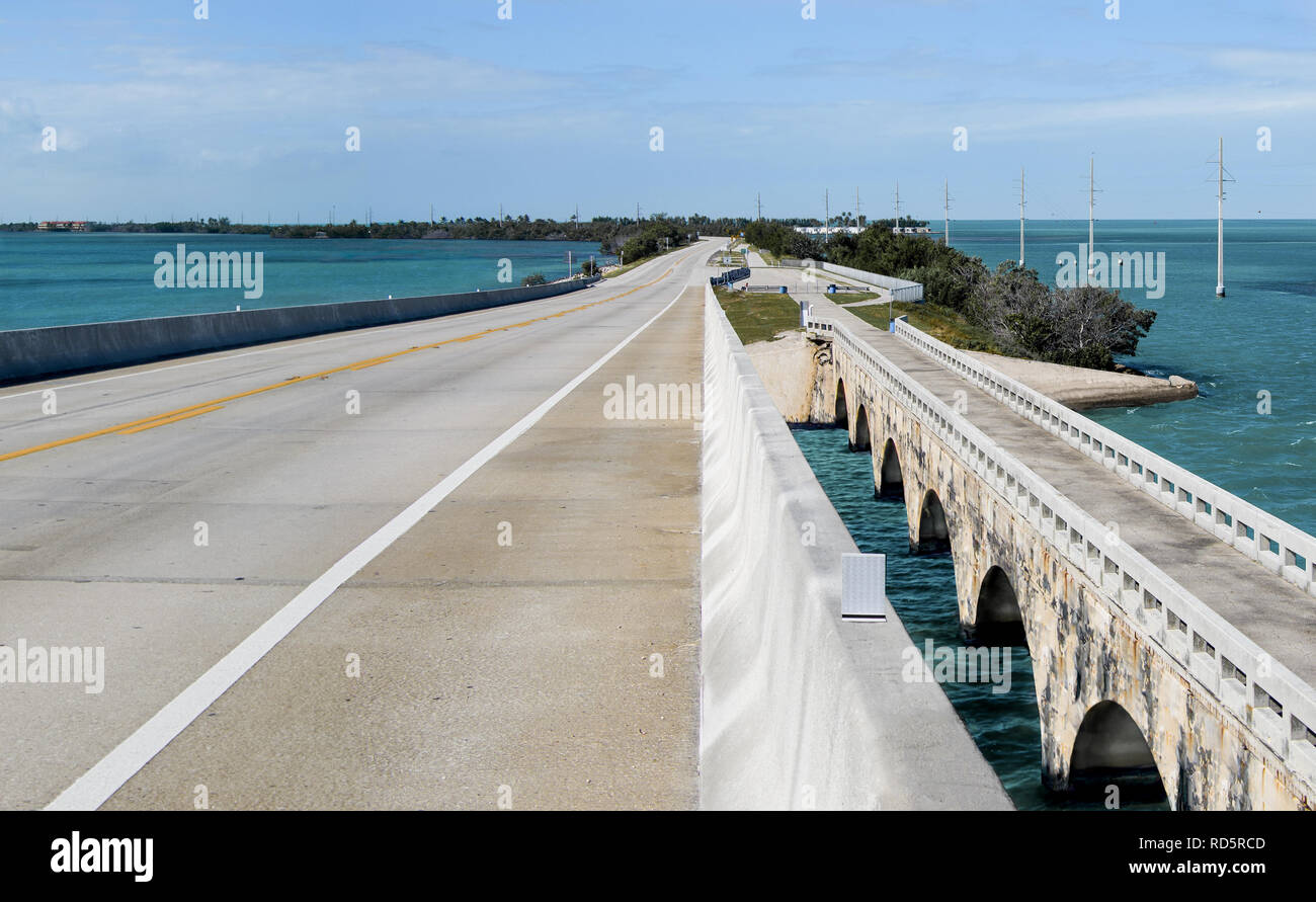 Overseas Highway: A modern bridge passes beside its older counterpart (now a fishing pier) as US Route 1 connects the Florida Keys. Stock Photo