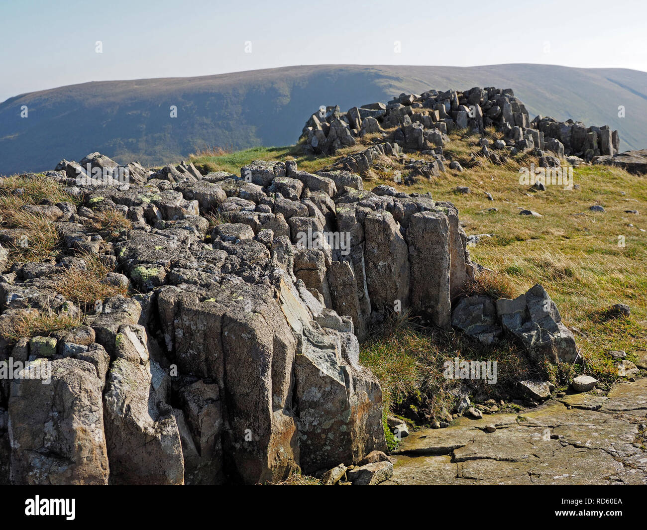 spectacular landscape with upland rock formations in the Lakeland Fells on the way up to High Street in Cumbria, England, UK Stock Photo