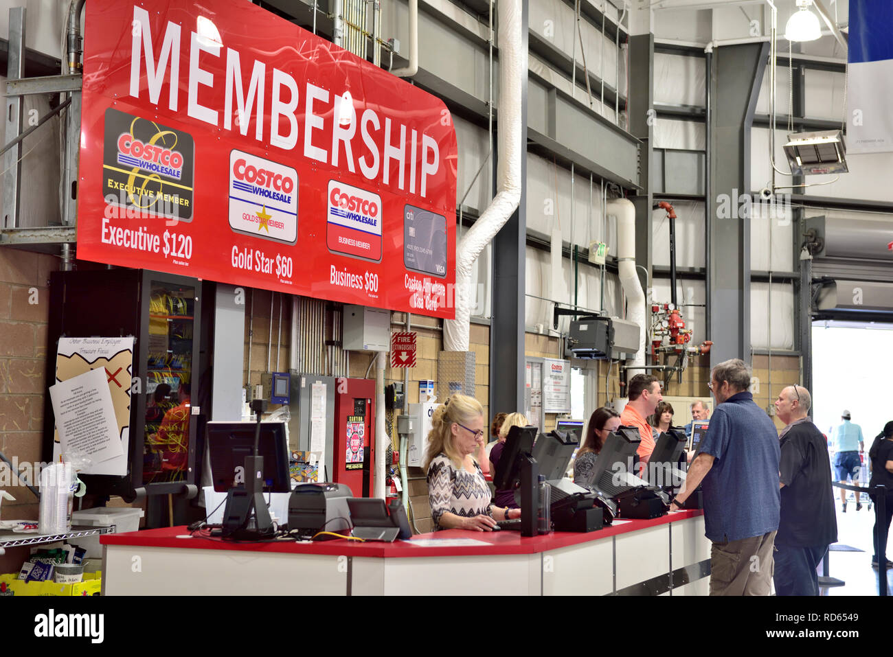 Costco wholesale warehouse membership counter with sign indicating costs of types of membership, USA Stock Photo