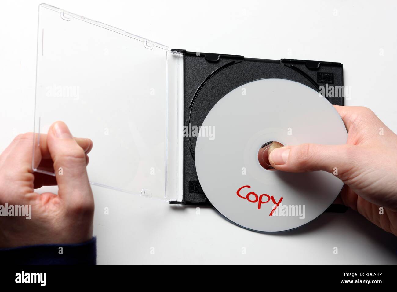 Hands holding a CD or DVD labeled copy Stock Photo