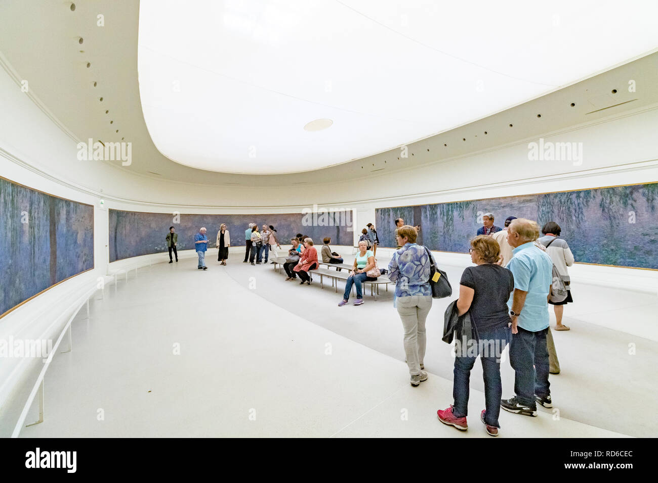People Admiring The Claude Monet Water Lilies Murals At The Musee De L Orangerie An Art Gallery Located In The West Corner Of The Tuileries Paris Stock Photo Alamy