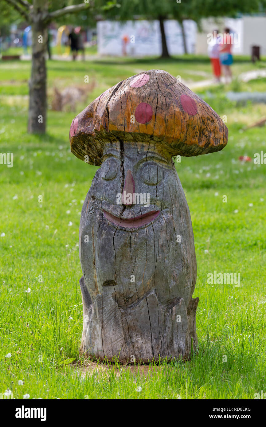 Beautiful carved wood columns, mushroom shapes, in the beach near the lake Balaton, village Vonyarcvashegy of Hungary Stock Photo