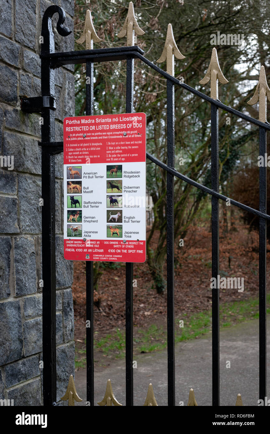 Restricted dog breeds listing on park gate at the Knockreer estate entrance to Killarney National Park, County Kerry, Ireland Stock Photo