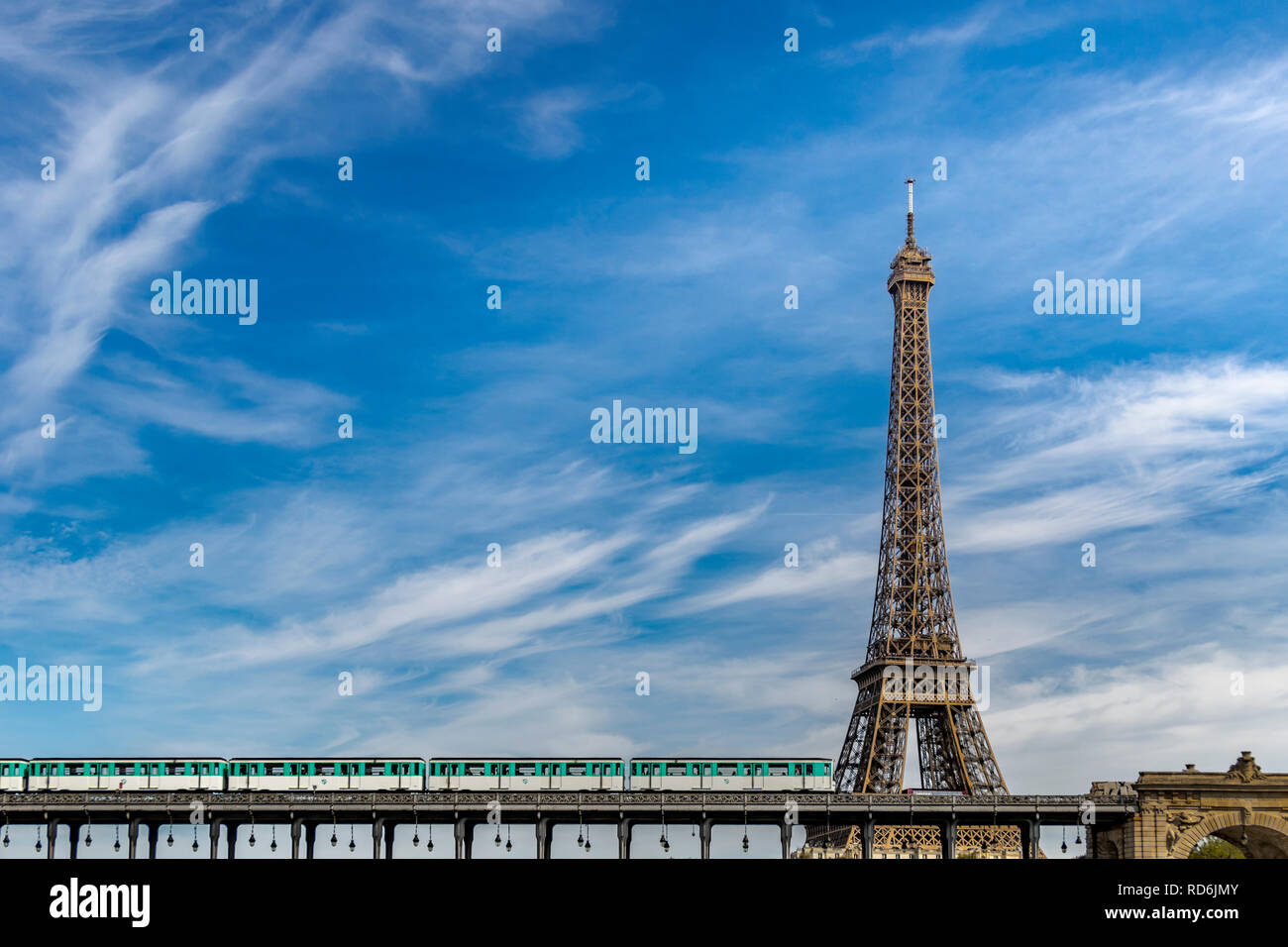 Paris Metro No 6 line train crosses the River Seine via Pont de Bir-Hakeim and passes by The Eiffel Tower Stock Photo