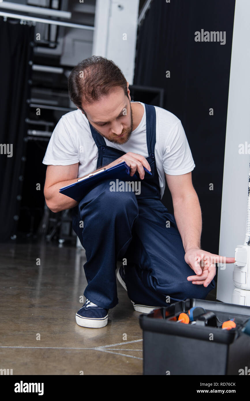 Bearded man electrician repair hi-res stock photography and images - Alamy