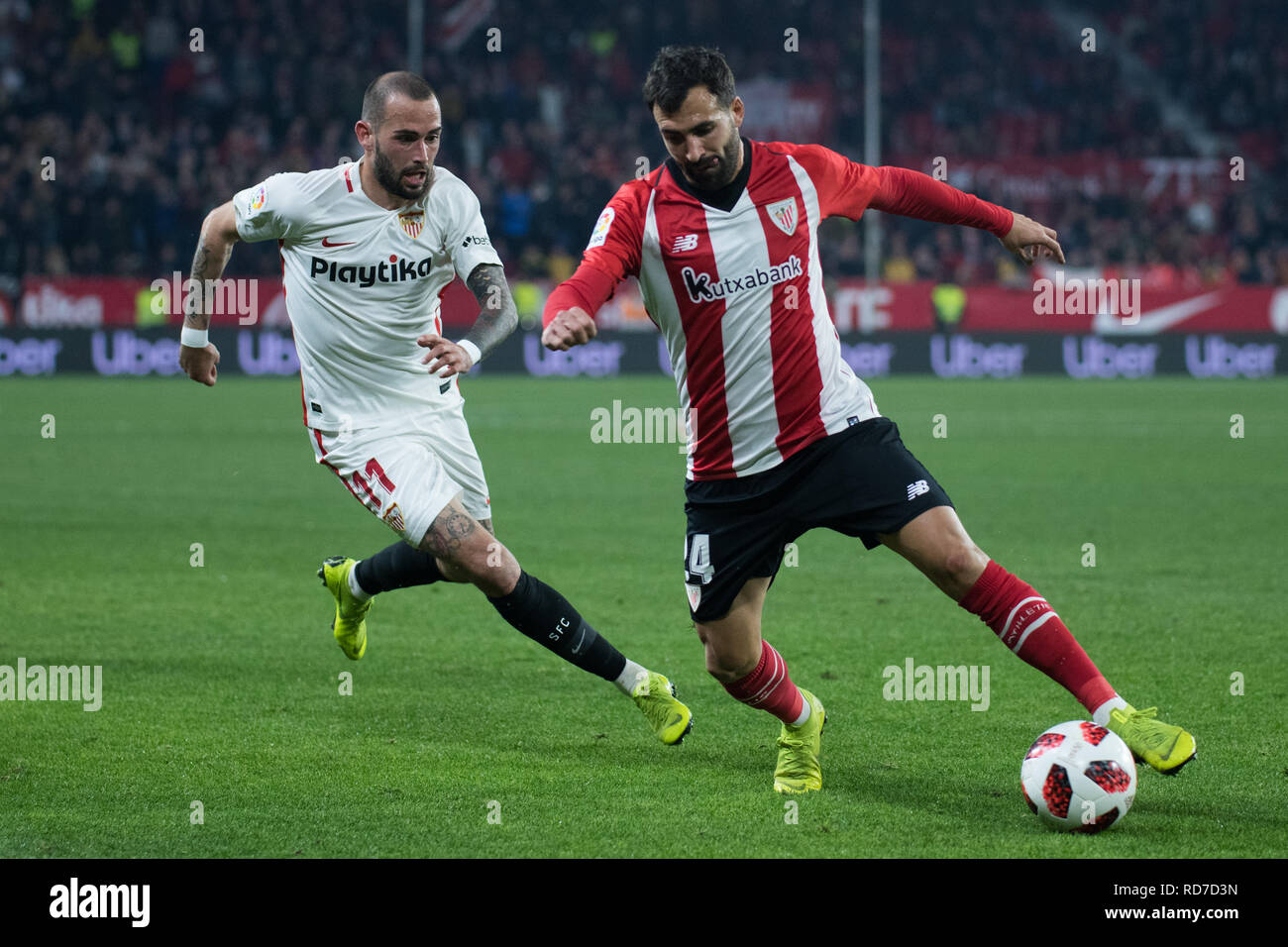 Sevilla, Spain. 16th Jan, 2019. Aleix Vidal of Sevilla FC and Balenciaga of  Athletic Club competes for the ball during the Copa del Rey match between  Sevilla FC v Athletic Club at
