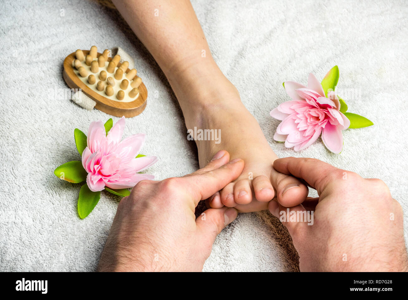 Woman gets foot massage Stock Photo Alamy