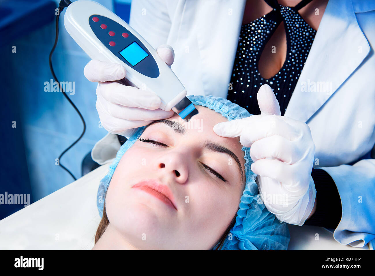 Procedure of ultrasonic cleaning of face. Ultrasonic scrubber.Medical