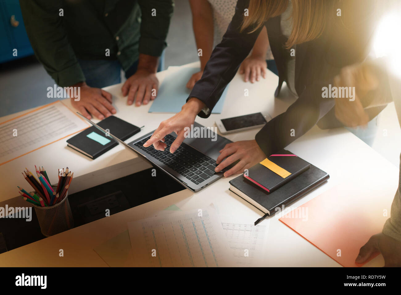 Close up of several hands working on computer in modern workplace Stock ...