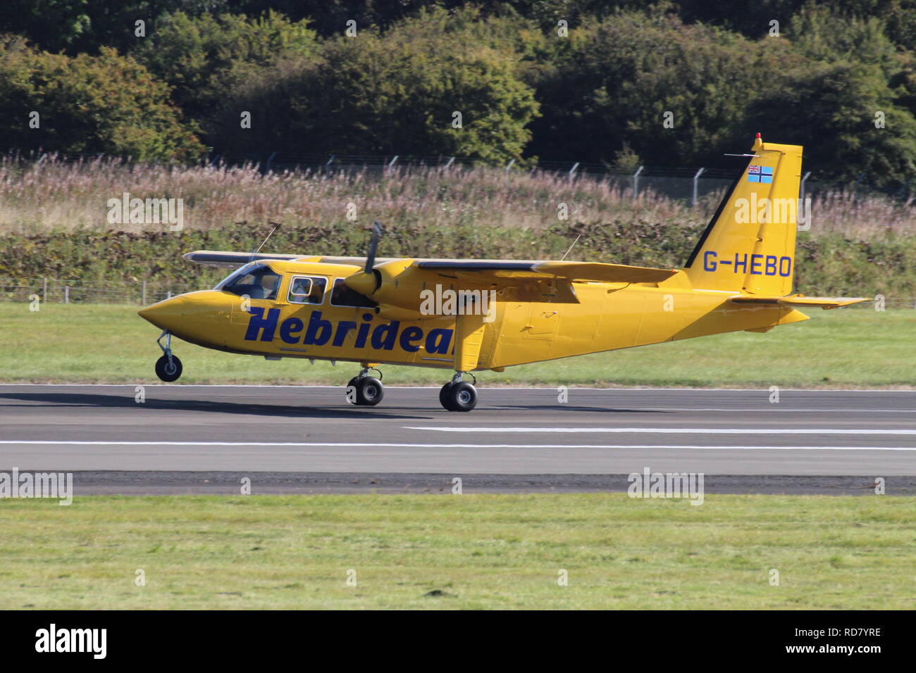 G-HEBO, a Britten-Norman BN-2B Islander operated by Hebridean Air Services, carrying out pleasure flights at Prestwick Airport in Ayrshire. Stock Photo