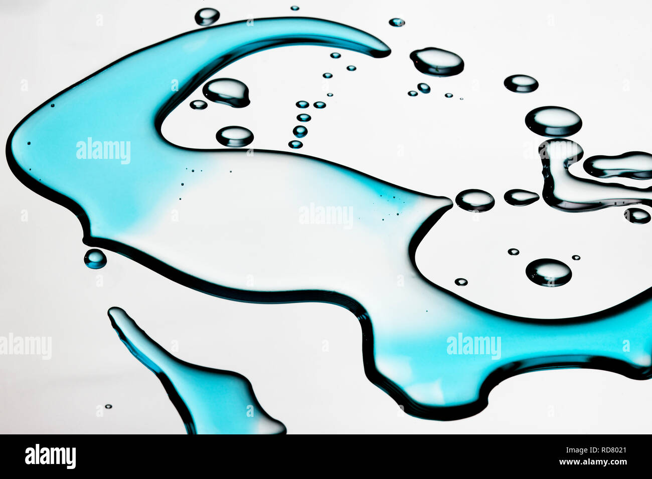 Close up image of spilled blue liquid on white background Stock Photo