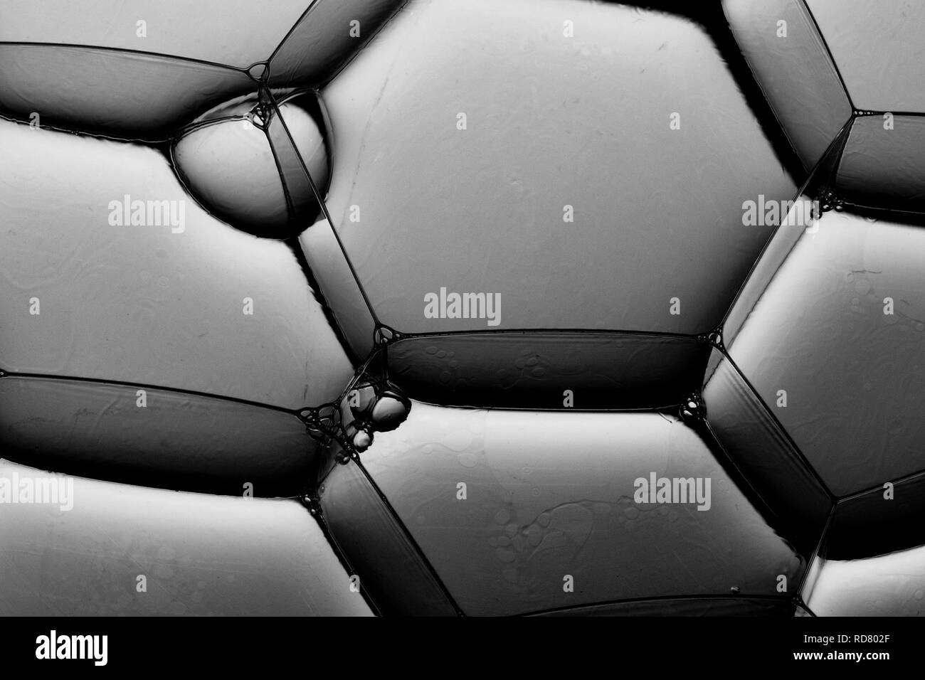 Close up of hexagonal bubbles in grey, studio shot Stock Photo