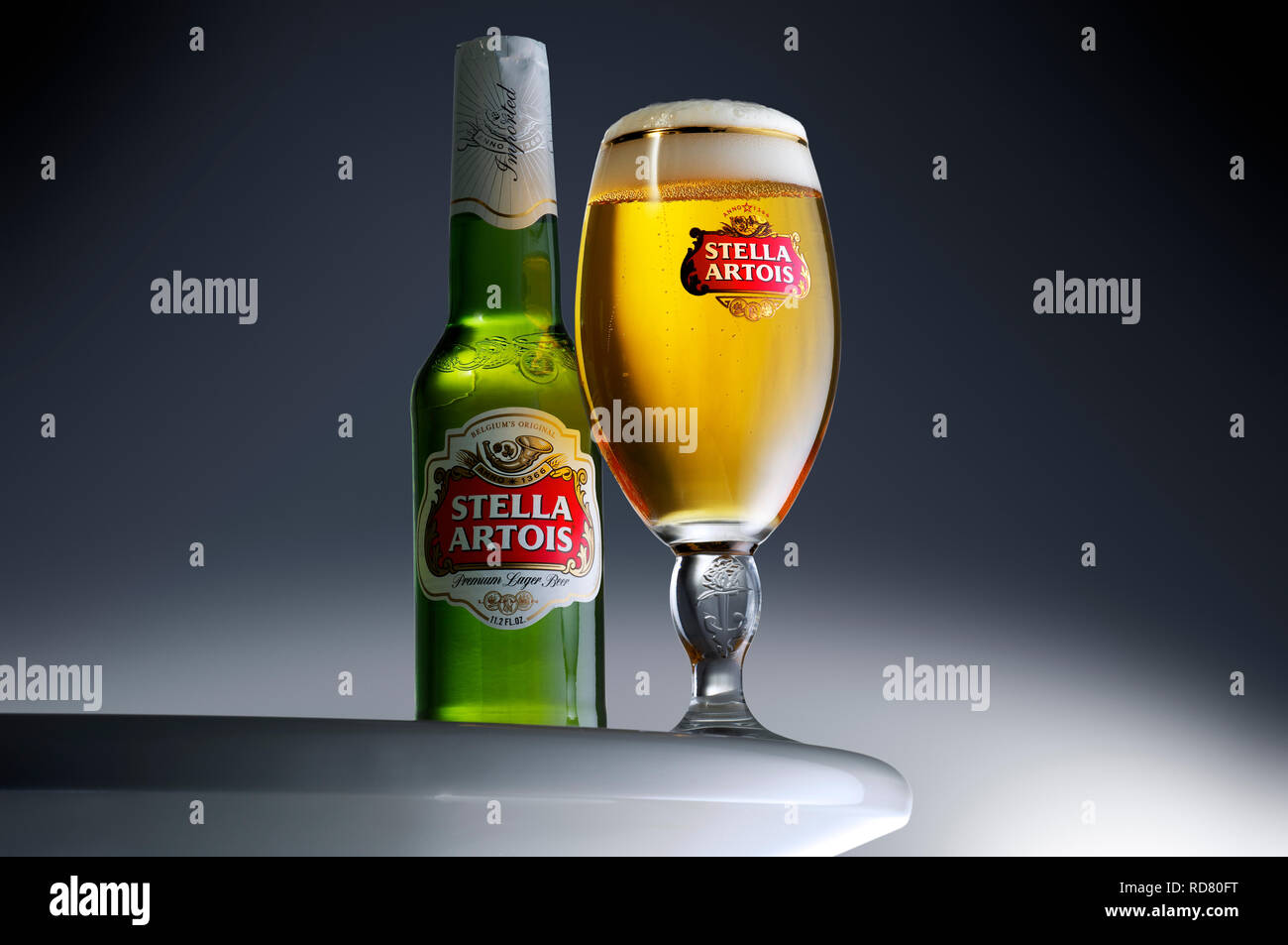 Bottle of Stella Artois and full glass, studio shot Stock Photo
