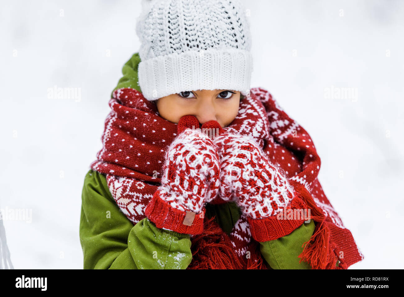 Close-Up Of Man In Warm Clothing Standing Against Sky Stock Photo